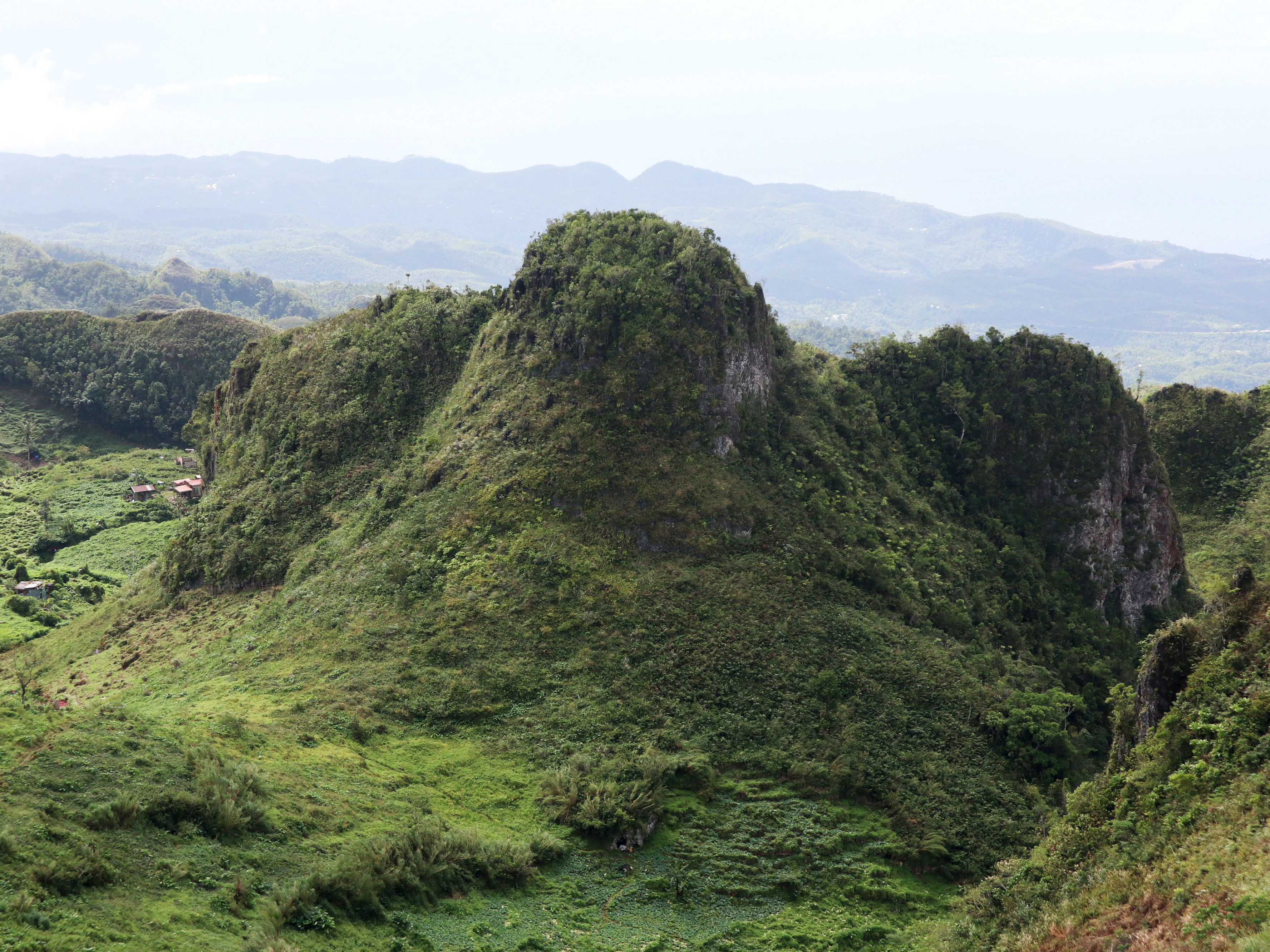 Rocky Mantalongon highland slope near Campgrounds at Mantalongon and Osmeña Peak