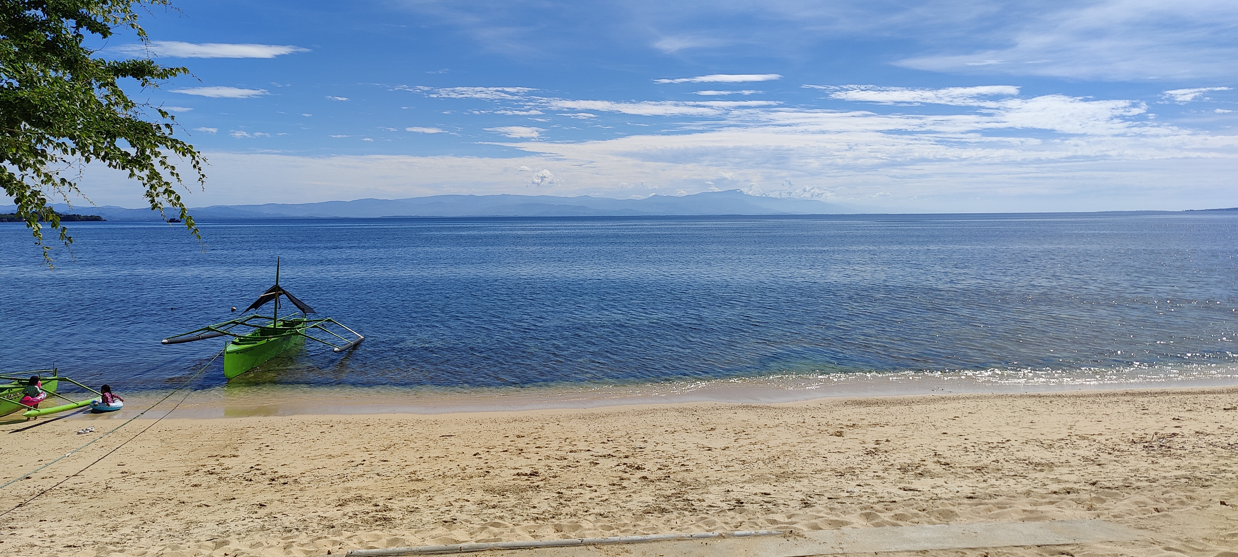 Tambobong Beach shoreline used by boats going to Colibra Island Beach Camp
