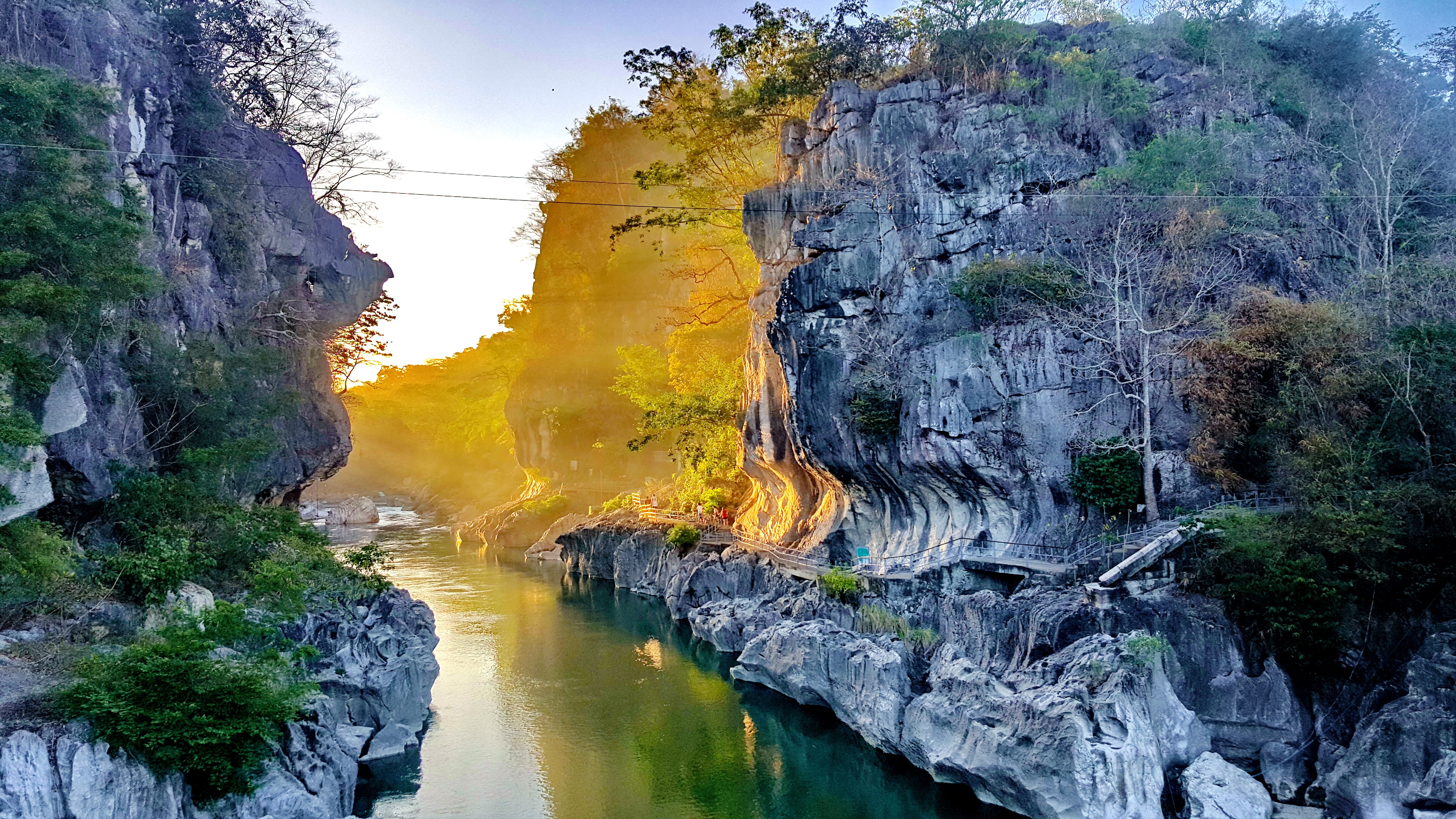 Hanging bridge over the river at Minalungao National Park Campsite